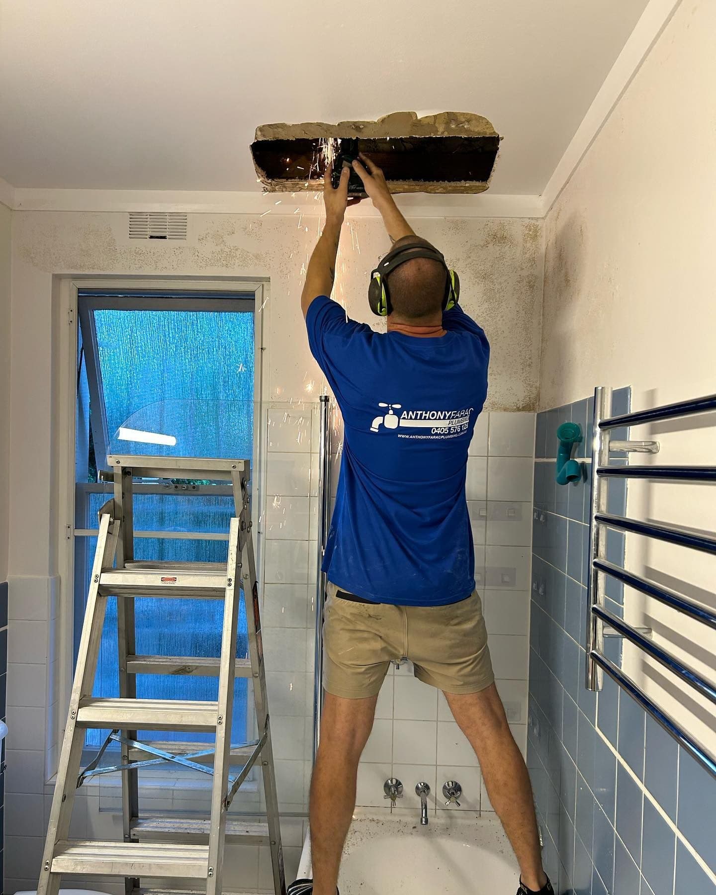 AFP plumber fixing leaking pipe in bathroom ceiling, Lane Cove AFP plumber fixing leaking pipe in bathroom ceiling, Lane Cove